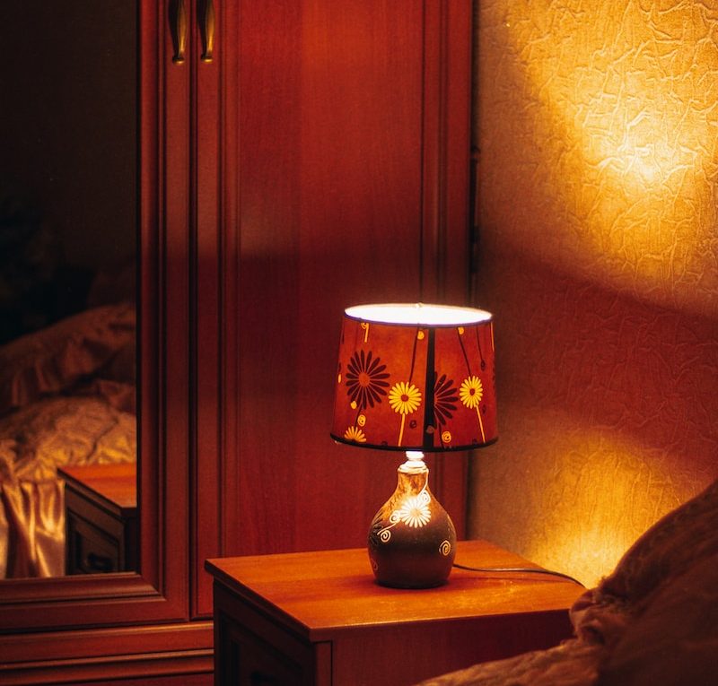 brown and white table lamp on brown wooden table